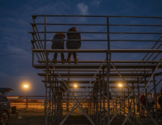 The spectator stands empty out as night comes near the conclusion.