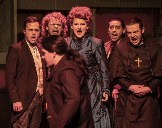 Cayden Couchman, playing Henry Jekyll and Edward Hyde, is pictured as Jekyll as he faces a group of critics opposed to his scientific work in a Thursday, October 5, 2023 dress rehearsal of "Jekyll &amp; Hyde," playing on the Palace's Springer Stage through November 5.    Photo by Andy Sharp
