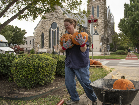 Cassie Ervin helps distribute pumpkins  at Georgetown's First United Methodist Church.