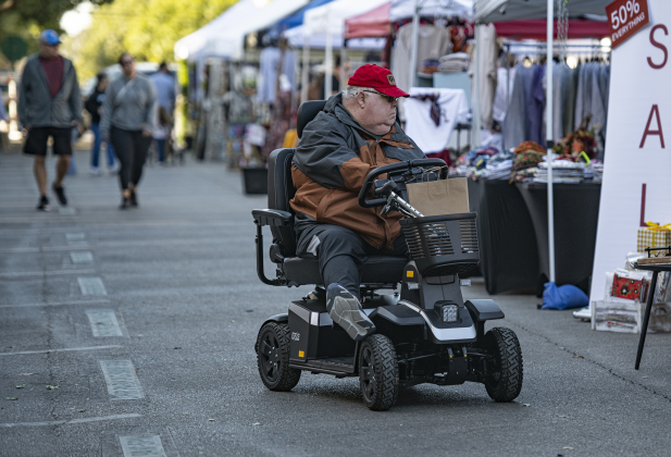 Duane White shops with his family along Main Street.