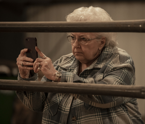 Darlene Wiley takes photos of her grandson Parker Munz, 15, of Bell County as Parker shows his ram named Big Boy during the Chisholm Trail Showdown Breeding Sheep Show, held Thursday, October 26, 2023 at the Williamson County Expo Center during the Williamson County Fair and Rodeo.