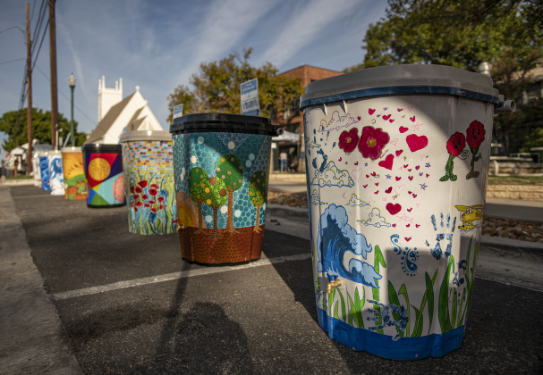 Colorfully-painted rain barrels along East 9th Street  were available to highest bidders  at the South Main Arts Festival on Saturday, October 21, 2023.