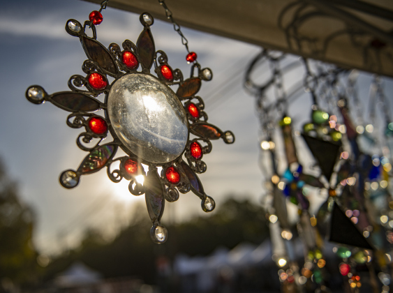 The work of Sunshine Sunbeams Glass owner Tina Couet of Kerrville was available for sale  at the South Main Arts Festival on Saturday, October 21, 2023. The piece shown has a vintage projector lens as its centerpiece.