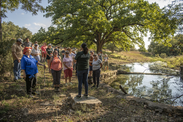 Attendees gather for a land blessing at Pecan Springs Karst Preserve on Saturday, September 23, 2023 on National Public Lands Day.