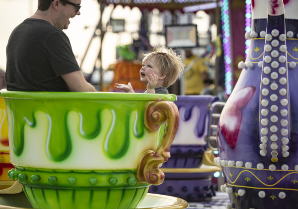 Brian Sullivan and his son Ciaran, who will be 2-years-old in December, enjoy a Tea Cup ride together on the midway  on  Wednesday, October 25, 2023, the opening day of the Williamson County Fair and Rodeo, held at the Williamson County Expo Center through October 28th.