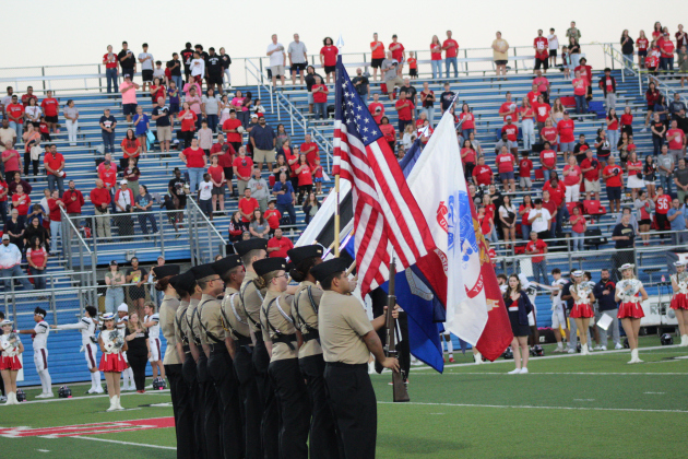 Flags are presented by GISD ROTC cadets for the signing of the National Anthem. Photo by Nalani Nuylan.