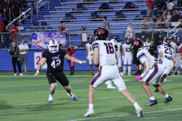 East View High School football quarterback Ty Blair tries to find an open player to pass the ball during the October 13 match against the Georgetown Eagles. Photo by Nalani Nuylan.