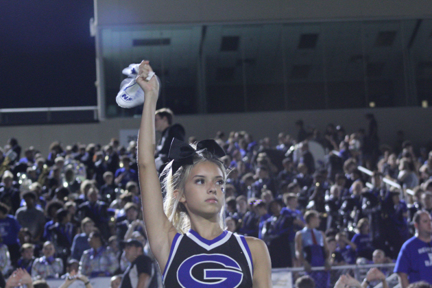 A Georgetown cheerleader twirls her towel in support for the Eagles after the East View Patriots score the first touchdown. Photo by Nalani Nuylan.