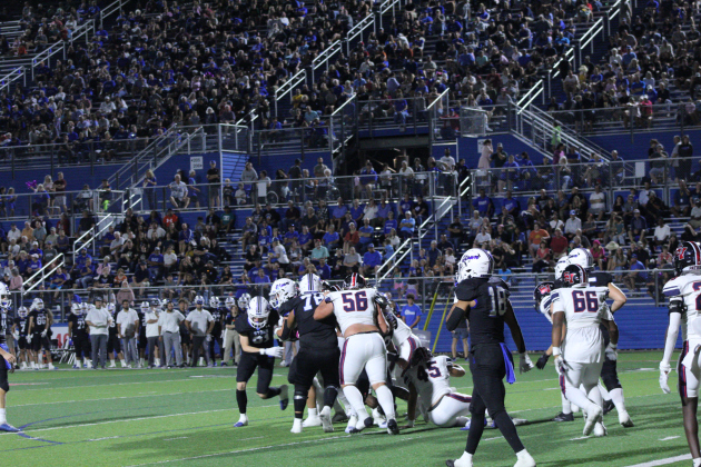The East View Patriot offense tries to tackle a Georgetown Eagle  during the second quarter of the game. Photo by Nalani Nuylan.