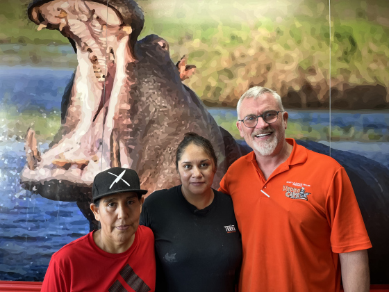 Restaurant owner Scott Feller with his longest-standing employees, Lily (left) and Gina.