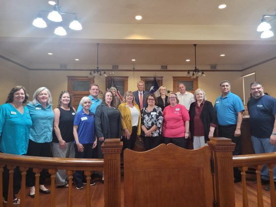 Williamson County Commissioners and representatives from food pantries across the county pose for a photo during the November 7 Commissioners Court at the county courthouse. Photo by Nalani Nuylan.
