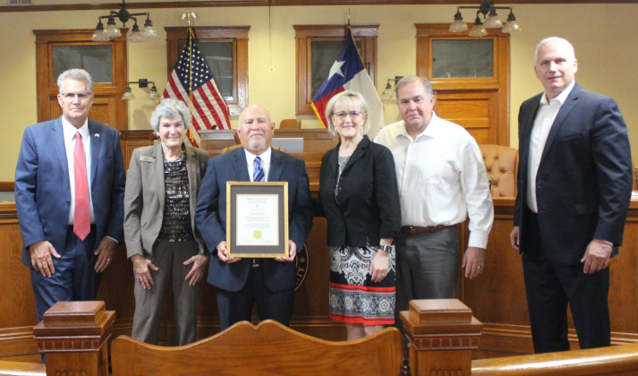 Salvador Lopez, center, was recognized for his 40 years of service in Juvenile Services at the November 7 Commissioners meeting at the county courthouse. Photo courtesy of Williamson County. 