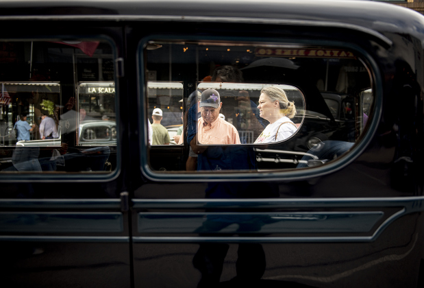 Bubba and Lisa Shelton are framed in a window of a 1929 REO auto, an entry in Taylor's Main Street Car Show on Saturday, October 28, 2023.