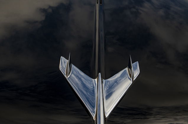 The hood ornament on a black 1956 Chevrolet Bel-Air owned by Juan DeAnoa reflects the sky above Main Street during Taylor's Main Street Car Show on Saturday, October 28, 2023.