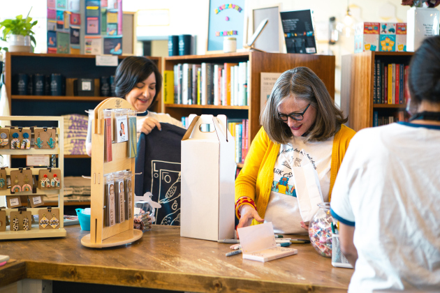 Jane Estes and Misty Adair organize shelves at Lark and Owl Booksellers.