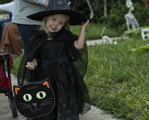 2-year-old Eleanor Loveridge, dressed as a witch, enjoyed time with her  family along Main Street in Old Town on Tuesday, October 31, 2023.