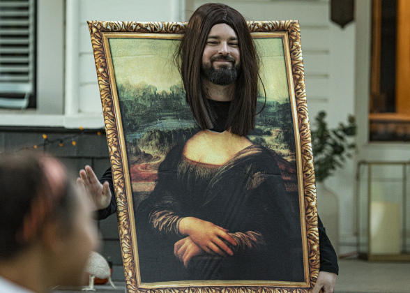 Main Street resident Alex Revard, dressed as the Mona Lisa painting, greeted trick-or-treaters at his home  in Old Town on Tuesday, October 31, 2023.