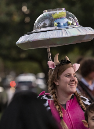 Alissa Middleton wore a spaceship on her head with a "Toy Story" character inside it as she enjoyed Halloween with her family along  Main Street in Old Town on Tuesday, October 31, 2023.