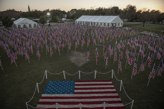 American flags adorn a field behind the Hammerlun Center for Leadership and Learning on Friday, November 3, 2023, the evening before the official opening of the 7th Annual Field of Honor.