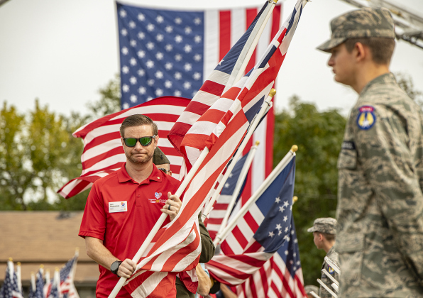 Rotary Club of Georgetown President Jeff Cartledge leads the Parade of Colors at  the Field of Honor site during the event's opening ceremonies on Sunday, November 5, 2023.