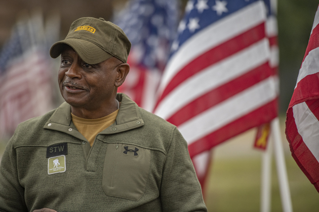 U.S. Army Ranger veteran Will Williams, a 1st Sergeant veteran, was surrounded by  American flags at the Field of Honor on Saturday, November 4, 2023.