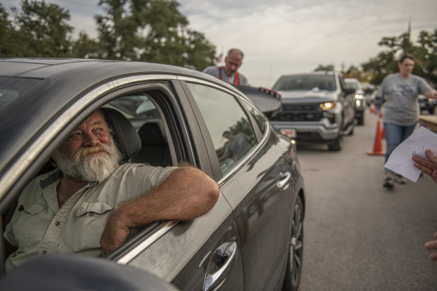 John Buerfeind waits while his 16 sausage plate orders are loaded during the 51st Annual Wurstbraten at Zion Lutheran Church on Monday, November 6, 2023.