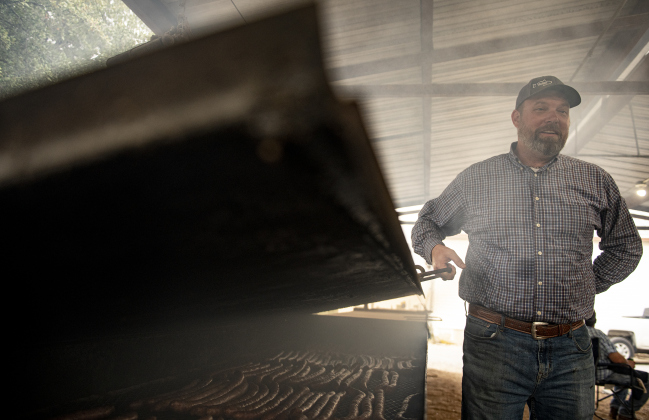 Doug Boram keeps an eye on one of the smoking pits during the 51st Annual Wurstbraten at Zion Lutheran Church on Monday, November 6, 2023.