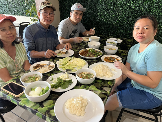 Jaiwai family enjoying a meal after their shift, from left, Peen Jaiwai, Phan Jaiwai, Tom Emerson, Noon Jaiwai.