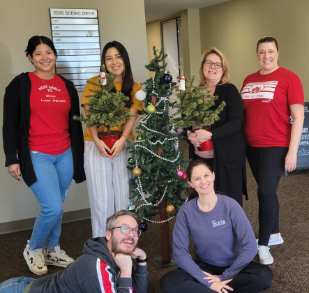 CASA of Williamson County office staff poses for a holiday photo. From left to right font is James Arrington and Marissa Austin. In the back row, Bethany Lopez, Natalie De La Torre, Trish Garrett, and Wendy McRae.  Photo courtesy of Tina Clary.