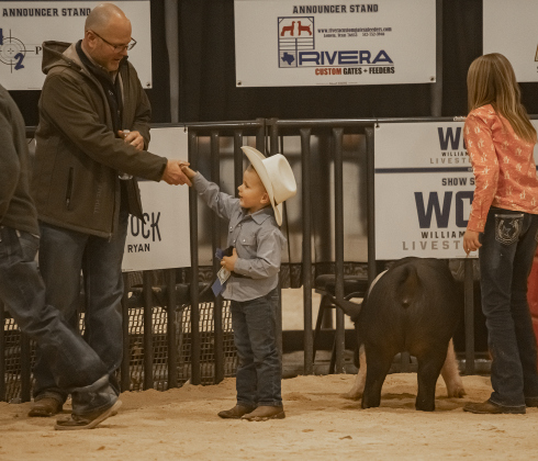 4-year-old Lane Jirasek of Thrall shakes the hand of Swine Show judge Kelton Mason after he and his pig took part in the Future Feeders event designed for kids 7 and under on Wednesday, December 6, 2023 during the Williamson County Livestock Show being held at the Williamson County Expo Center.