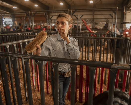 15-year-old Bralyn Baird, a member of  the Liberty Hill FFA program,  prepares one of her pigs for the Breeding Swine Show at the Williamson County Livestock Show on Tuesday, December 5, 2023.