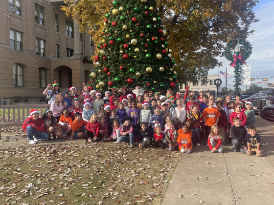 A group of Liberty Hill students stand with Santa on the Square December 7.  Photo by Nicholas Cicale