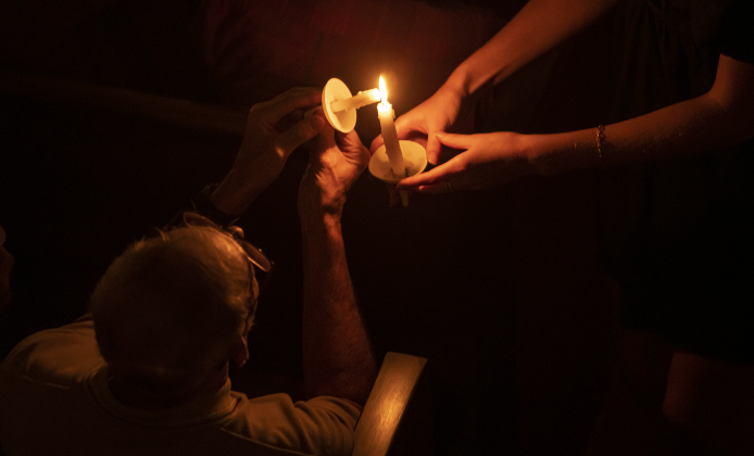 Candles are lighted  during Southwestern University's Candlelight Service at Lois Perkins Chapel on Thursday, December 7, 2023.