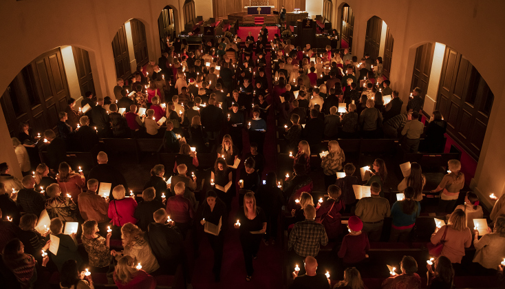 Members of the Southwestern University Chorale lead attendees in the recessional at Southwestern University's Candlelight Service at Lois Perkins Chapel on Thursday, December 7, 2023.