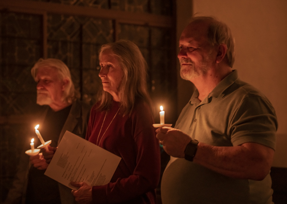 Glenn Holzer, left, Sue Holzer, center, and Mike Cook, right, attended  Southwestern University's Candlelight Service at Lois Perkins Chapel on Thursday, December 7, 2023.