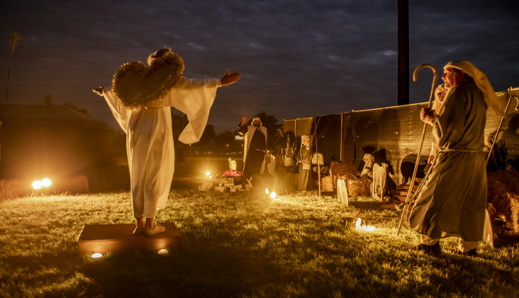 Yvonne Oude-Reimerink, dressed as an angel, speaks to attendees at  Immanuel Lutheran Church for their Pilgrimage to Bethlehem, the church''s Live Nativity, on Saturday, December 9, 2023.
