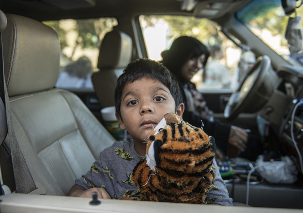 5-year-old Santana Olguin, with his mom Destiny Olguin,  was among the recipients during the Georgetown Police Department's Blue Santa distribution, held Saturday, December 16, 2023.