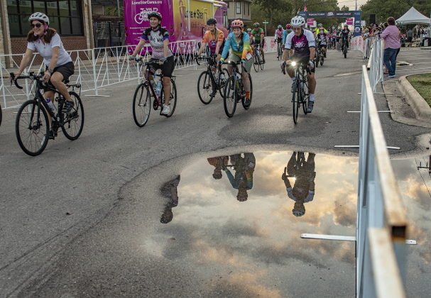 Participants navigated around puddles of water from rain at the start of the Texas Mamma Jamma Ride, held on Saturday, September 16. The ride began and concluded at Taylor’s Heritage Square Park, including mileage distances of 15, 25, 50 or 70 miles. The annual event is sponsored by Lone Star Circle of Care, with all proceeds from the ride used to support operation and administration of the Big Pink Bus, Lone Star’s mobile mammography unit.