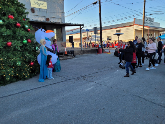 Jarrell residents wait in line to have their children take photos with Anna, Elsa and Olaf in front of Jarrell’s Christmas Tree during A Very Merry Jarrell on December 16.