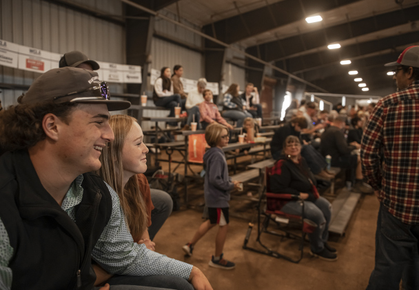 17-year-old Dawson Meiske, a member of the Thrall FFA program, sits with his girlfriend Allison Dibling, 17, as he waits with other competitors to re-enter the competition arena  during  the Market Rabbit Show at the Williamson Livestock Show  on Sunday, December 3, 2023.