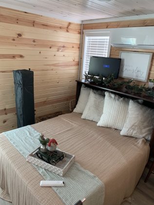 The model cabin allows visitors to envision what the bedroom could look like during the holiday season. (Photo by Kaitlyn Wilkes)
