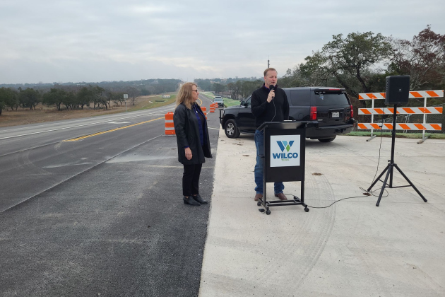 Precinct 2 Commissioner Cynthia Long, left, and Liberty Hill ISD Superintendent Steve Snell give speeches about the partnership between the county and school district in order to build County Road 258.  Photo by Nalani Nuylan.