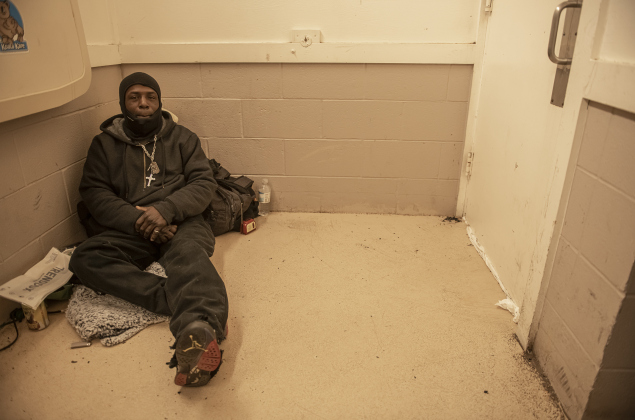Malcolm Ricks finds warmth in a restroom behind the Grace Heritage Center on Sunday, January 14.