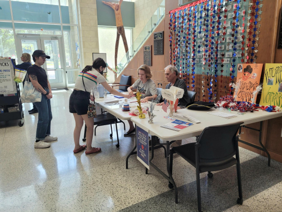  League of Women Voter volunteers help residents register to vote for their first election at the Georgetown library on September 19, 2023. Photo by Nalani Nuylan.