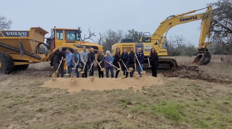 Williamson County Commissioner Cynthia Long, along with Liberty Hill City Council members, LJA representatives and Chasco contractors, break ground on the Liberty Hill Bypass. Photo by Nalani Nuylan.