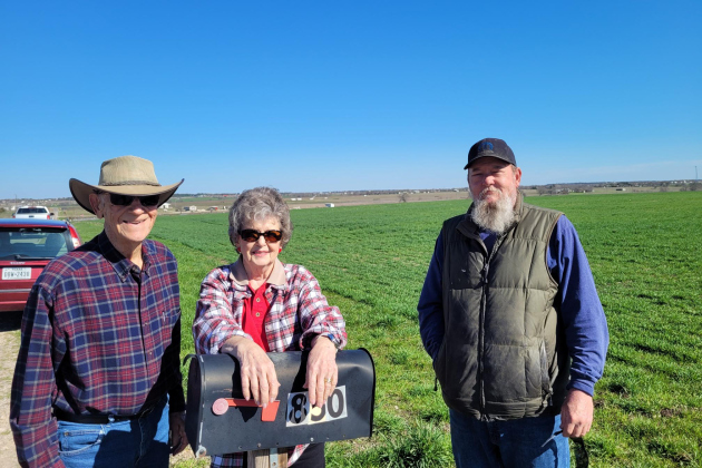 Betty Liese and her family pose in front of their family farm in Weir. There are plans for an Atmos Energy pipeline to run through the middle of the property, which has been in her husband’s family for 100 years. Photo by Nalani Nuylan.