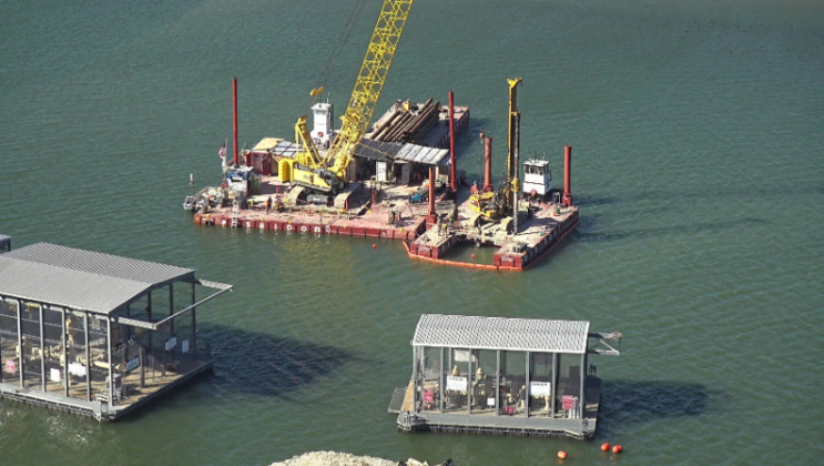 A construction barge floats on Lake Travis ready to replace a pipeline for the Brushy Creek Regional Utility Authority. Photo courtesy of the City of Leander.