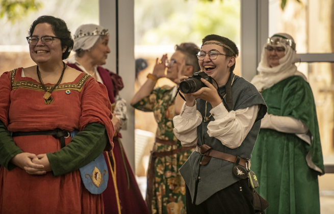 Society for Creative Anachronism member Cassian wears a big smile as she takes photos  at the San Gabriel Community Center on Saturday, February 3, 2024.
