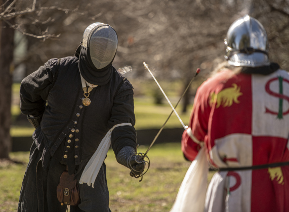 Mateo, left, squares off against Etienne, whose real-world name is Theron Bretz, during a fencing match.