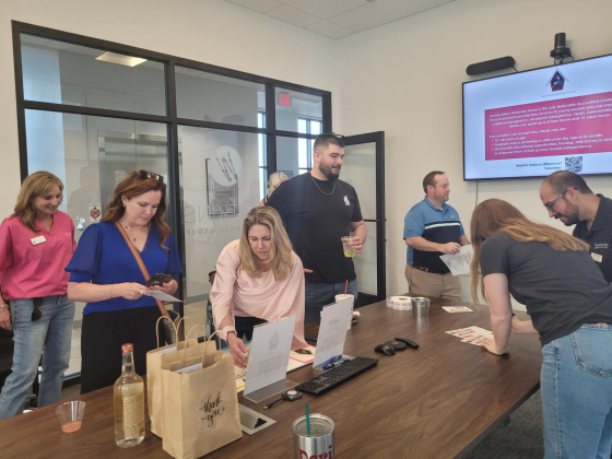 Residents visit staff from Annunciation Maternity Home and Opportunities for Williamson and Burnet Counties for a non-profit Happy Hour at Wadkins Insurance Agency.